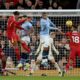 Liverpool's Virgil van Dijk, 2nd left, jumps to head the ball during the English Premier League soccer match between Liverpool and Manchester City at Anfield Stadium, Liverpool, England, Sunday Dec. 1, 2024. (AP Photo/Ian Hodgson)