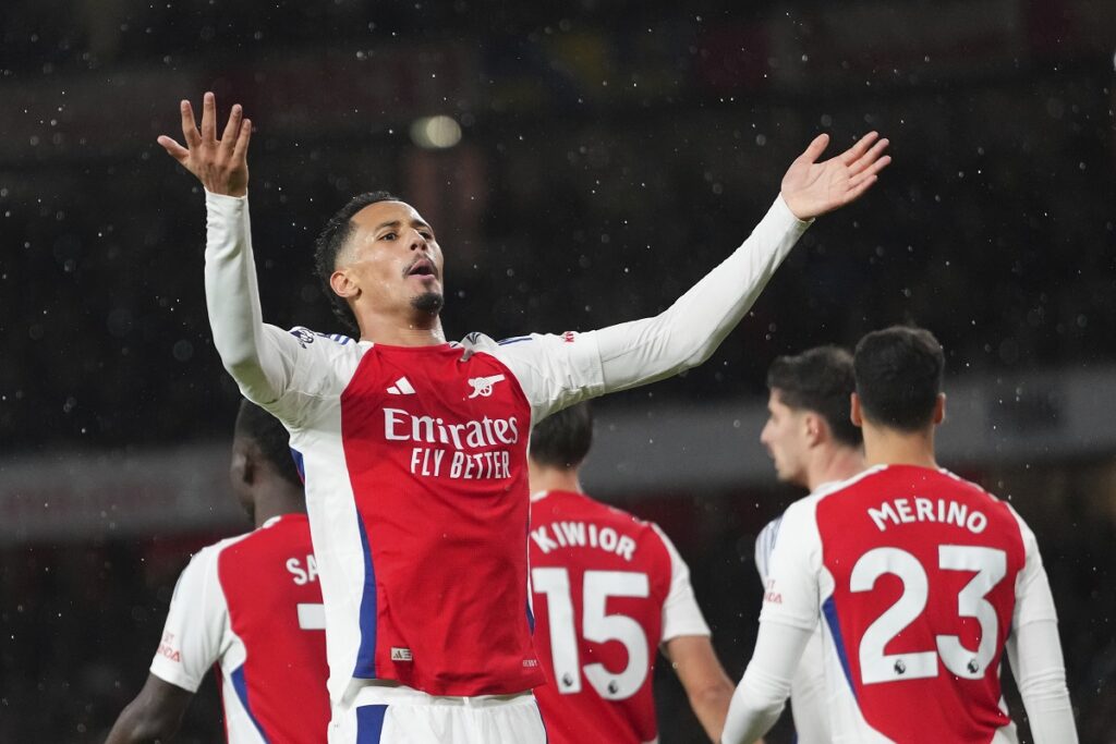 Arsenal's William Saliba celebrates after scoring his side's second goal during the English Premier League soccer match between Arsenal and Manchester United at Emirates stadium in London, Wednesday, Dec. 4, 2024. (AP Photo/Kirsty Wigglesworth)