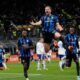 Inter Milan's Carlos Augusto, center, celebrates after scoring against Como during a Serie A soccer match between Inter Milan and Como at the San Siro stadium in Milan, Italy, Monday, Dec. 23, 2024. (AP Photo/Luca Bruno)