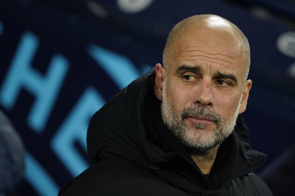 Manchester City's head coach Pep Guardiola waits for the start of the English Premier League soccer match between Manchester City and Nottingham Forest at the Etihad Stadium in Manchester, Wednesday, Dec. 4, 2024. (AP Photo/Dave Thompson)