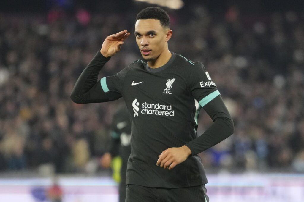 Liverpool's Trent Alexander-Arnold celebrates after scoring his side's fourth goal during the English Premier League soccer match between West Ham United and Liverpool at the London Stadium in London, Monday, Dec. 30, 2024. (AP Photo/Kirsty Wigglesworth)