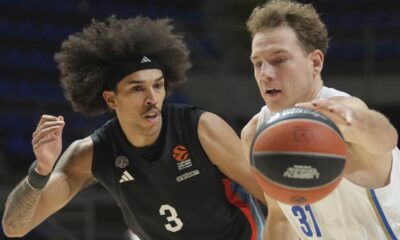 Maccabi's Rokas Jokubaitis, right, drives to the basket as Paris Basketball's Tyson Ward tries to block him during the Euroleague basketball match between Maccabi Tel Aviv and Paris Basketball in Belgrade, Serbia, Tuesday, Dec. 3, 2024. (AP Photo/Darko Vojinovic)