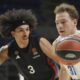 Maccabi's Rokas Jokubaitis, right, drives to the basket as Paris Basketball's Tyson Ward tries to block him during the Euroleague basketball match between Maccabi Tel Aviv and Paris Basketball in Belgrade, Serbia, Tuesday, Dec. 3, 2024. (AP Photo/Darko Vojinovic)