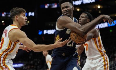 New Orleans Pelicans center Yves Missi (21) looses the ball againmst Atlanta Hawks guard Bogdan Bogdanovic (13) during the first half of an NBA basketball game, Monday, Dec. 2, 2024, in Atlanta. (AP Photo/Mike Stewart)