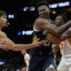 New Orleans Pelicans center Yves Missi (21) looses the ball againmst Atlanta Hawks guard Bogdan Bogdanovic (13) during the first half of an NBA basketball game, Monday, Dec. 2, 2024, in Atlanta. (AP Photo/Mike Stewart)