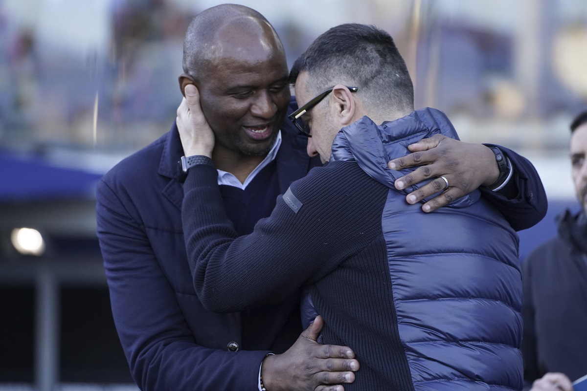 Genoa's head coach Patrick Vieira, left, and Empoli's head coach Roberto D'Aversa hug before the Serie A soccer match between Empoli and Genoa at the Carlo Castellani stadium in Empoli, Italy, Saturday, Dec. 28, 2024. (Marco Bucco/LaPresse via AP)