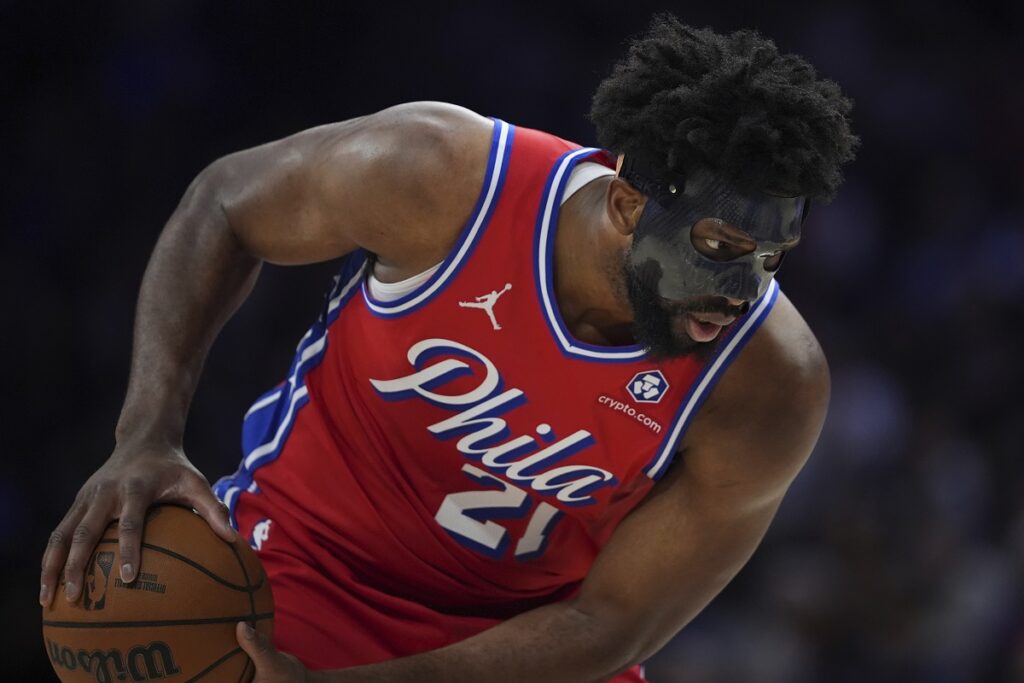 Philadelphia 76ers' Joel Embiid holds the ball during the second half of an NBA basketball game against the Charlotte Hornets, Friday, Dec. 20, 2024, in Philadelphia. (AP Photo/Matt Slocum)