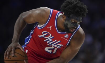 Philadelphia 76ers' Joel Embiid holds the ball during the second half of an NBA basketball game against the Charlotte Hornets, Friday, Dec. 20, 2024, in Philadelphia. (AP Photo/Matt Slocum)