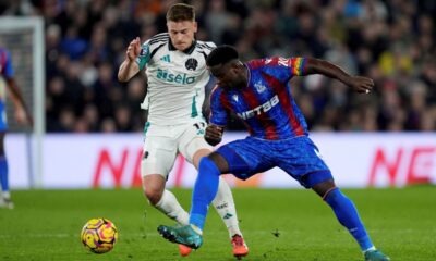 Newcastle United's Harvey Barnes, left, and Crystal Palace's Marc Guehi battle for the ball during the English Premier League soccer match between Crystal Palace and Newcastle United at Selhurst Park, London, Saturday Nov. 30, 2024. (Ben Whitley/PA via AP)