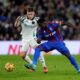 Newcastle United's Harvey Barnes, left, and Crystal Palace's Marc Guehi battle for the ball during the English Premier League soccer match between Crystal Palace and Newcastle United at Selhurst Park, London, Saturday Nov. 30, 2024. (Ben Whitley/PA via AP)