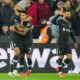 Liverpool's Cody Gakpo, left, celebrates with teammates after scoring his side's second goal during the English Premier League soccer match between West Ham United and Liverpool at the London Stadium in London, Sunday, Dec. 29, 2024. (AP Photo/Kirsty Wigglesworth)