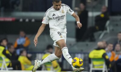 Real Madrid's Kylian Mbappe takes control of the ball during the Spanish La Liga soccer match between Real Madrid and Getafe at the Santiago Bernabeu Stadium in Madrid, Spain, Sunday, Dec. 1, 2024. (AP Photo/Bernat Armangue)