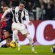 Juventus' Dusan Vlahovic, right, and Cagliari's Mateusz Wieteska, left, challenge for the ball during the round of sixteen Coppa Italia soccer match between Juventus Turin and Cagliari Calcio in Turin, Italy, Tuesday, Dec. 17, 2024. (Fabio Ferrari/LaPresse via AP)