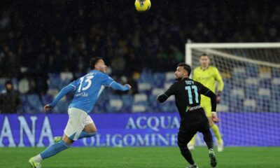 Napoli's Amir Rrahmani, left, and Lazio's Taty Castellanos challenge for the ball during the Serie A soccer match between Napoli and Lazio at the Diego Armando Maradona Stadium in Naples, Sunday, Dec. 8, 2024. (Alessandro Garofalo/LaPresse via AP)