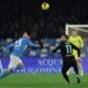 Napoli's Amir Rrahmani, left, and Lazio's Taty Castellanos challenge for the ball during the Serie A soccer match between Napoli and Lazio at the Diego Armando Maradona Stadium in Naples, Sunday, Dec. 8, 2024. (Alessandro Garofalo/LaPresse via AP)