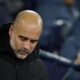 Manchester City's head coach Pep Guardiola waits for the start of the English Premier League soccer match between Manchester City and Nottingham Forest at the Etihad Stadium in Manchester, Wednesday, Dec. 4, 2024. (AP Photo/Dave Thompson)