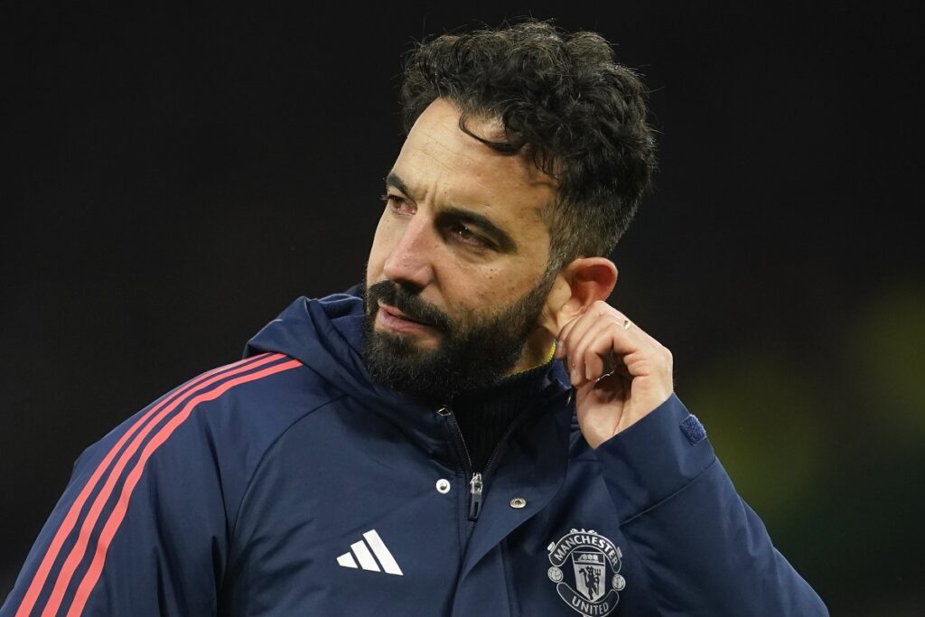 Manchester United's head coach Ruben Amorim pulls on his ear after the English Premier League soccer match between Manchester United and Bournemouth at the Old Trafford stadium in Manchester, England, Sunday, Dec. 22, 2024. (AP Photo/Dave Thompson)