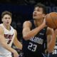 Orlando Magic forward Tristan da Silva (23) looks for a shot as Miami Heat guard Pelle Larsson (9) tries to defend during the second half of an NBA basketball game, Saturday, Dec. 21, 2024, in Orlando, Fla. (AP Photo/John Raoux)