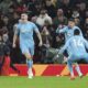 Nottingham Forest's Nikola Milenkovic (left) celebrates after scoring the opening goal during the English Premier League soccer match between Manchester United and Nottingham Forest, at Old Trafford, Manchester, England, Saturday Dec. 7, 2024. (Martin Rickett/PA via AP)