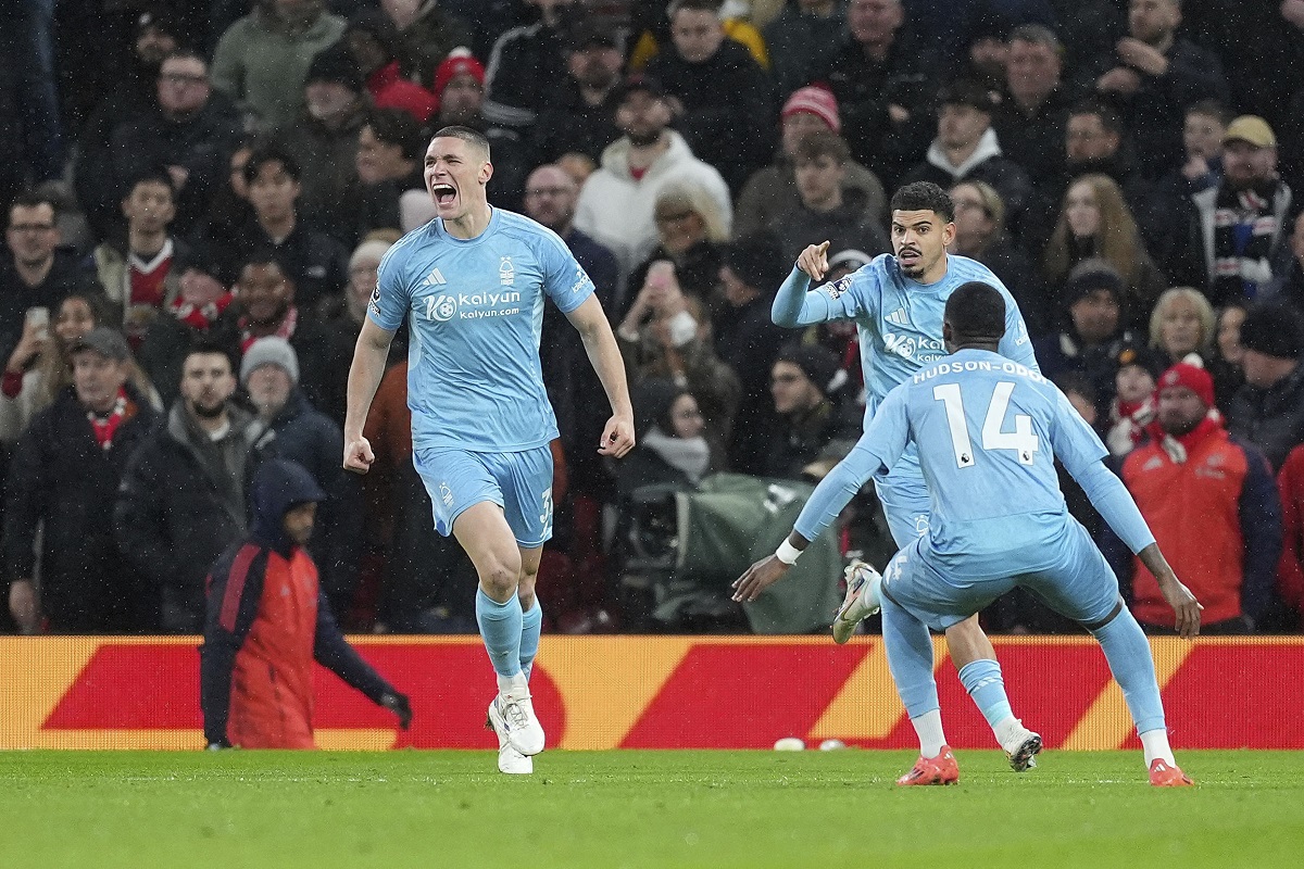 Nottingham Forest's Nikola Milenkovic (left) celebrates after scoring the opening goal during the English Premier League soccer match between Manchester United and Nottingham Forest, at Old Trafford, Manchester, England, Saturday Dec. 7, 2024. (Martin Rickett/PA via AP)