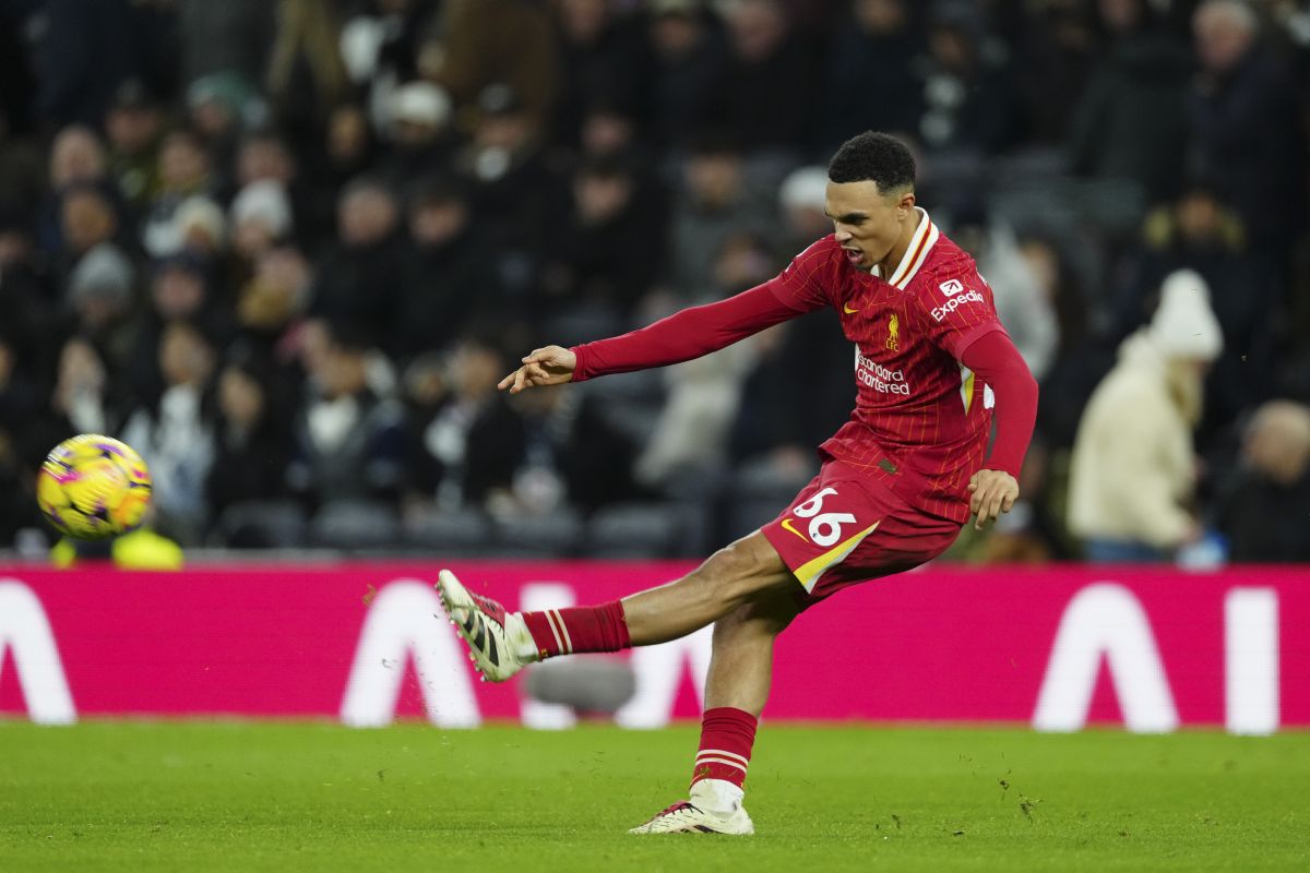 Liverpool's Trent Alexander-Arnold kicks the ball during the English Premier League soccer match between Tottenham and Liverpool at Tottenham Hotspur Stadium in London, Sunday, Dec. 22, 2024. (AP Photo/Dave Shopland)