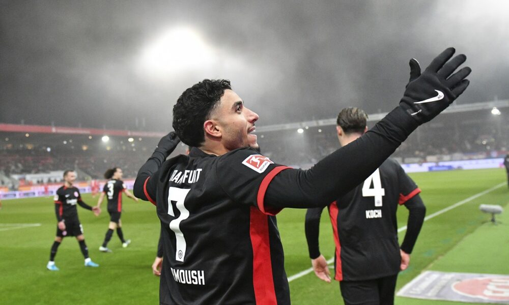 Frankfurt's scorer Omar Marmoush celebrate after scoring his team's third goal during the Bundesliga soccer match between FC Heidenheim and Eintracht Frankfurt at the Voith-Arena in Heidenheim, Germany, Sunday, Dec. 1, 2024. (Jan-Philipp Strobel/dpa via AP)