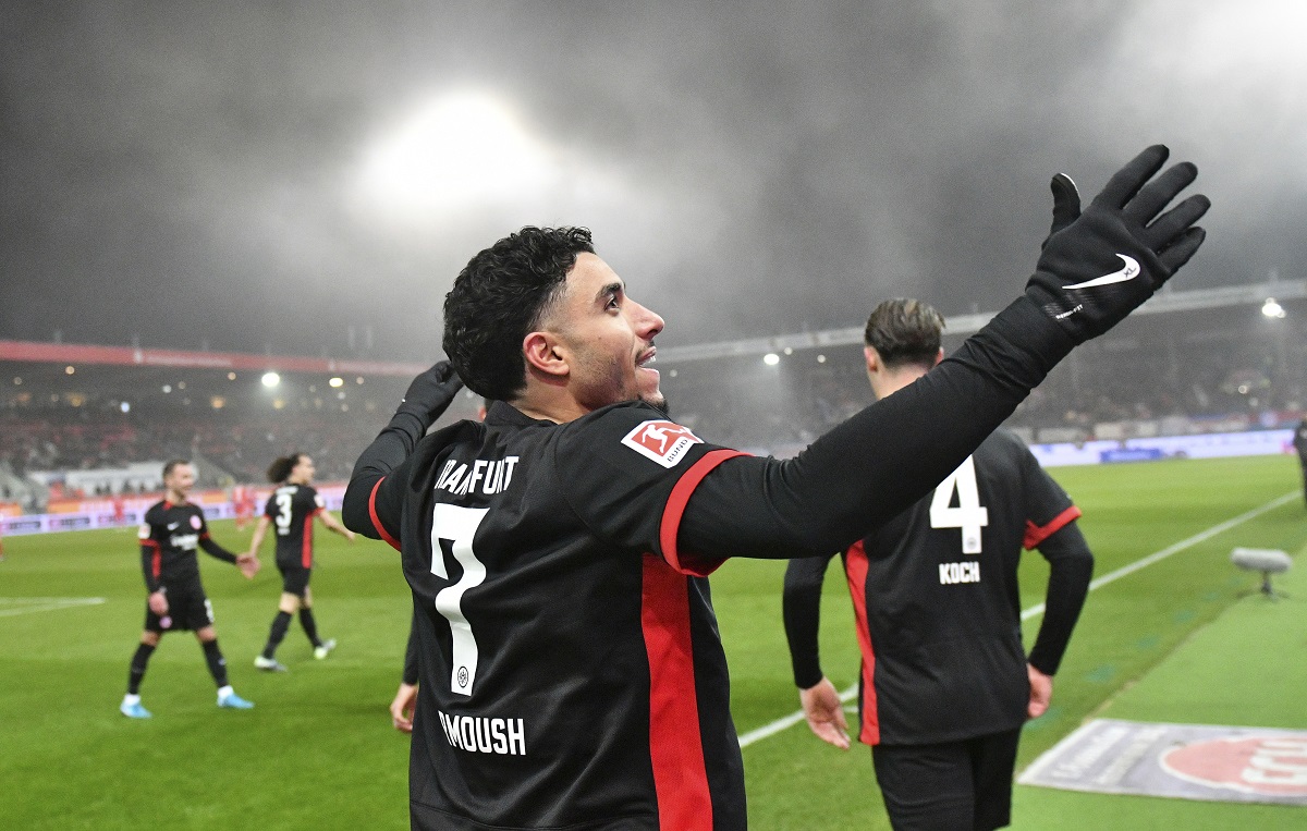 Frankfurt's scorer Omar Marmoush celebrate after scoring his team's third goal during the Bundesliga soccer match between FC Heidenheim and Eintracht Frankfurt at the Voith-Arena in Heidenheim, Germany, Sunday, Dec. 1, 2024. (Jan-Philipp Strobel/dpa via AP)