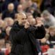 Manchester City's head coach Pep Guardiola puts up six fingers to remind the jeering fans of his six Premier League titles at the end of the English Premier League soccer match between Liverpool and Manchester City at Anfield Stadium, Liverpool, England, Sunday Dec. 1, 2024. (AP Photo/Ian Hodgson)