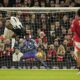 Newcastle's Alexander Isak, left, scores his side's opening goal during the English Premier League soccer match between Manchester United and Newcastle at the Old Trafford stadium in Manchester, England, Monday, Dec. 30, 2024. (AP Photo/Dave Thompson)