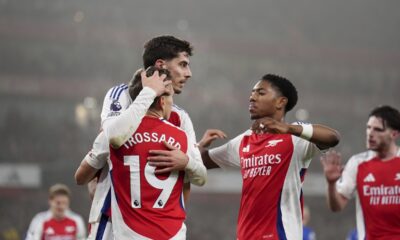 Arsenal's Kai Havertz, front center, celebrates after scoring the opening goal during the English Premier League soccer match between Arsenal and Ipswich at the Emirates Stadium in London, England, Friday, Dec. 27, 2024. (John Walton/PA via AP)