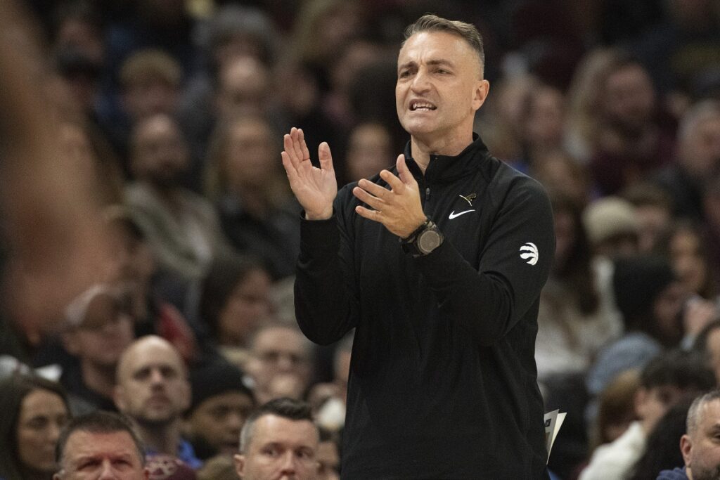 Toronto Raptors head coach Darko Rajakovic cheers his team during the second half of an NBA basketball game against the Cleveland Cavaliers in Cleveland, Sunday, Nov 24, 2024. (AP Photo/Phil Long)