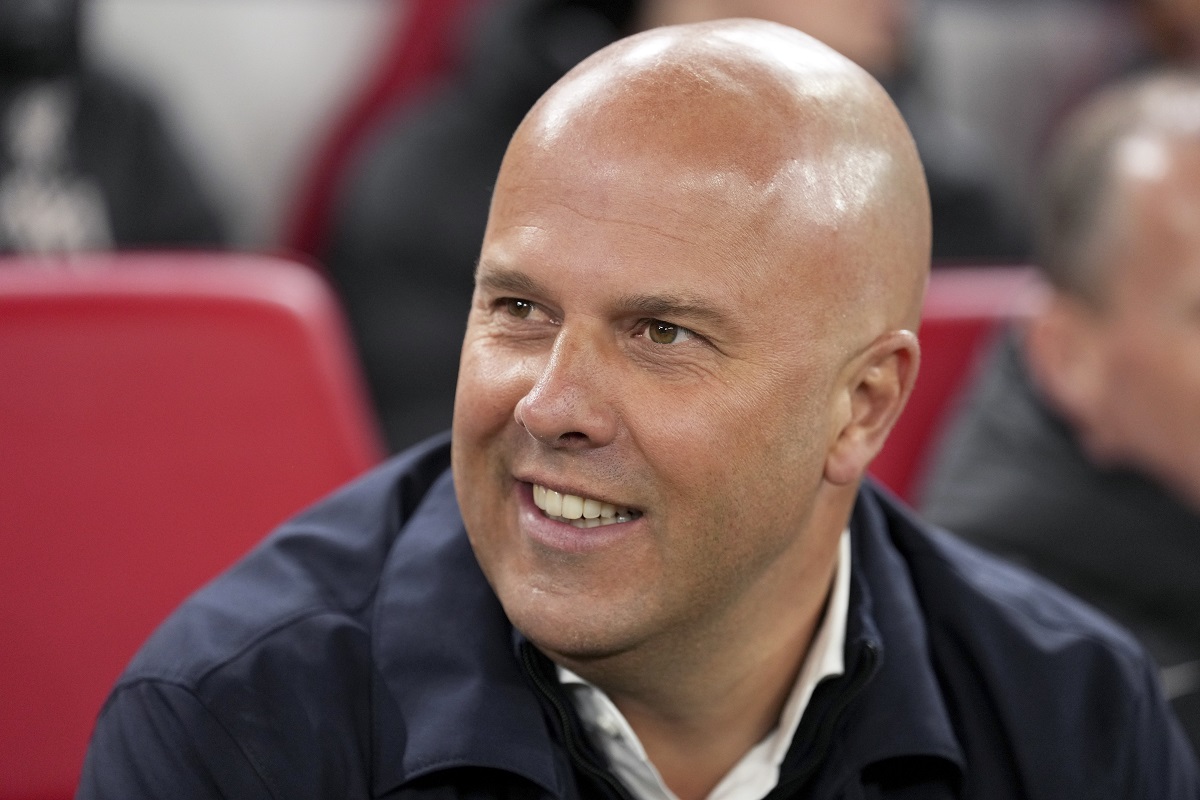 Liverpool's manager Arne Slot sits on the bench during the Champions League opening phase soccer match between Liverpool and Real Madrid at Anfield Stadium, Liverpool, England, Wednesday, Nov. 27, 2024. (AP Photo/Jon Super)