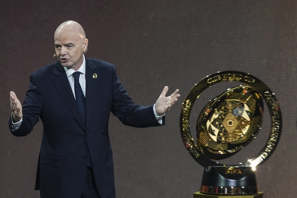 FILE - FIFA President Gianni Infantino' speaks next to the trophy during the draw for the 2025 FIFA Club World Cup soccer tournament, Thursday, Dec. 5, 2024, in Miami. (AP Photo/Rebecca Blackwell, File)