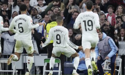 Real Madrid's Kylian Mbappe celebrates after scoring the opening goal during the Spanish La Liga soccer match between Real Madrid and Sevilla at the Santiago Bernabeu Stadium in Madrid, Spain, Sunday, Dec. 22, 2024. (AP Photo/Bernat Armangue)