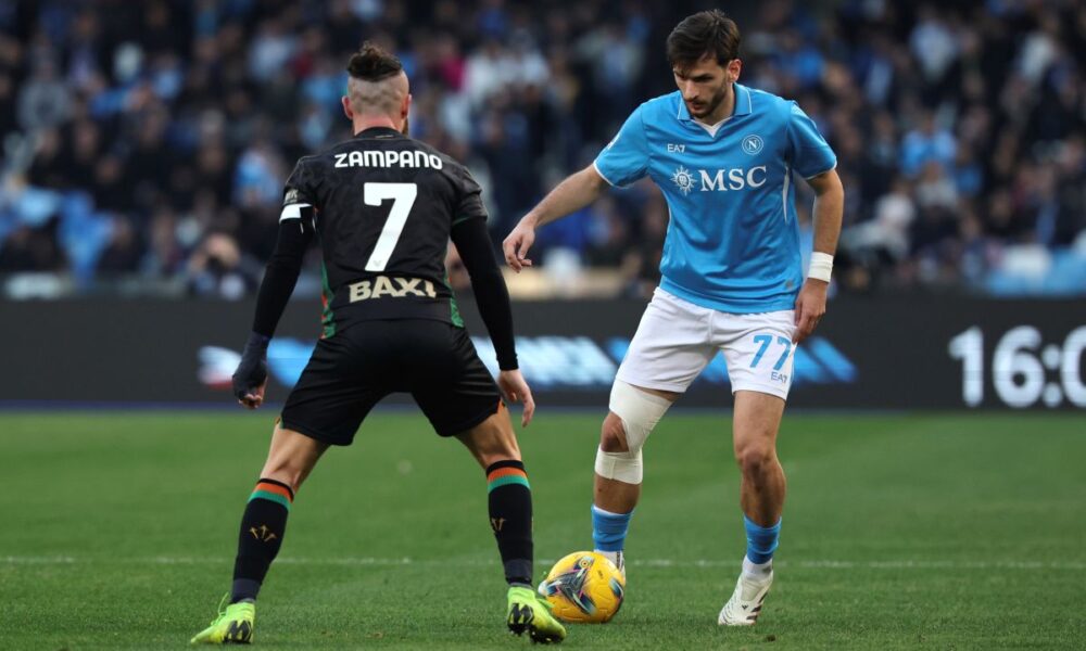 Napoli's Khvicha Kvaratskhelia, right, and Venezia's Francesco Zampano in action during the Serie A soccer match between Napoli and Venezia at the Diego Armando Maradona Stadium in Naples, Italy Sunday Dec. 29, 2024. (Alessandro Garofalo/LaPresse via AP)