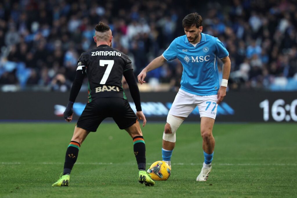 Napoli's Khvicha Kvaratskhelia, right, and Venezia's Francesco Zampano in action during the Serie A soccer match between Napoli and Venezia at the Diego Armando Maradona Stadium in Naples, Italy Sunday Dec. 29, 2024. (Alessandro Garofalo/LaPresse via AP)