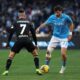 Napoli's Khvicha Kvaratskhelia, right, and Venezia's Francesco Zampano in action during the Serie A soccer match between Napoli and Venezia at the Diego Armando Maradona Stadium in Naples, Italy Sunday Dec. 29, 2024. (Alessandro Garofalo/LaPresse via AP)