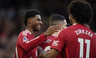 Manchester United's Marcus Rashford, left, celebrates with teammates after scoring during the English Premier League soccer match between Manchester United and Everton at the Old Trafford stadium in Manchester, England, Sunday, Dec. 1, 2024. (AP Photo/Dave Thompson)