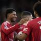 Manchester United's Marcus Rashford, left, celebrates with teammates after scoring during the English Premier League soccer match between Manchester United and Everton at the Old Trafford stadium in Manchester, England, Sunday, Dec. 1, 2024. (AP Photo/Dave Thompson)