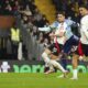 Arsenal's Bukayo Saka, centre, makes an attempt to score during the English Premier League soccer match between Fulham and Arsenal, at the Craven Cottage Stadium in London, Sunday, Dec. 8, 2024. (AP Photo/Dave Shopland)