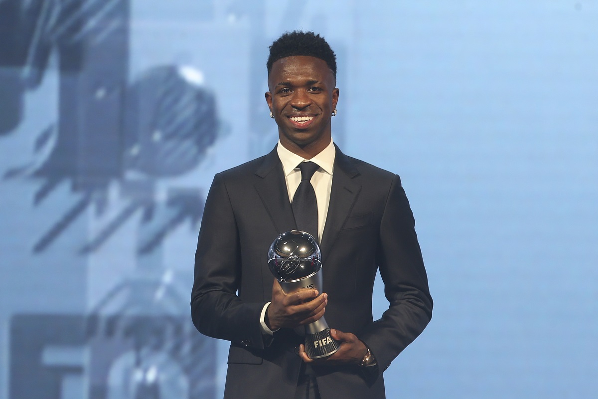 Vinicius Junior of Real Madrid is awarded as the Best Men's FIFA Player during the FIFA Football Awards 2024 in Doha, Qatar, Tuesday, Dec. 17, 2024. (AP Photo/Hussein Sayed)