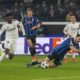 Atalanta's Sead Kolasinac, right, is fouled to earn his team a penalty kick during the Champions League opening phase soccer match between Atalanta and Real Madrid at the Bergamo's stadium, in Bergamo, Italy, Tuesday, Dec. 10, 2024. (AP Photo/Antonio Calanni)