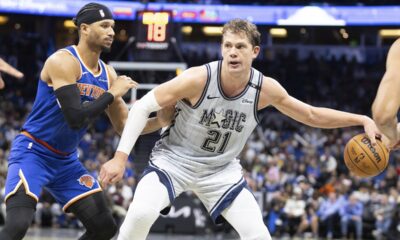 Orlando Magic center Moritz Wagner (21) evades New York Knicks guard Pacome Dadiet, left, during the second half of an NBA basketball game Sunday, Dec. 15, 2024, in Orlando, Fla. (AP Photo/Alan Youngblood)