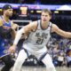 Orlando Magic center Moritz Wagner (21) evades New York Knicks guard Pacome Dadiet, left, during the second half of an NBA basketball game Sunday, Dec. 15, 2024, in Orlando, Fla. (AP Photo/Alan Youngblood)