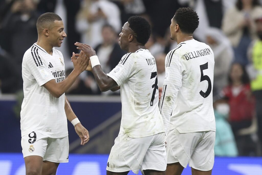 Real Madrid's Kylian Mbappe celebrates with his teammates after scoring the opening goal against CF Pachuca during the Intercontinental Cup soccer final match at the Lusail Stadium in Lusail, Qatar, Wednesday, Dec. 18, 2024. (AP Photo/Hussein Sayed)