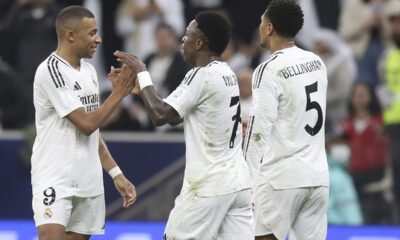 Real Madrid's Kylian Mbappe celebrates with his teammates after scoring the opening goal against CF Pachuca during the Intercontinental Cup soccer final match at the Lusail Stadium in Lusail, Qatar, Wednesday, Dec. 18, 2024. (AP Photo/Hussein Sayed)