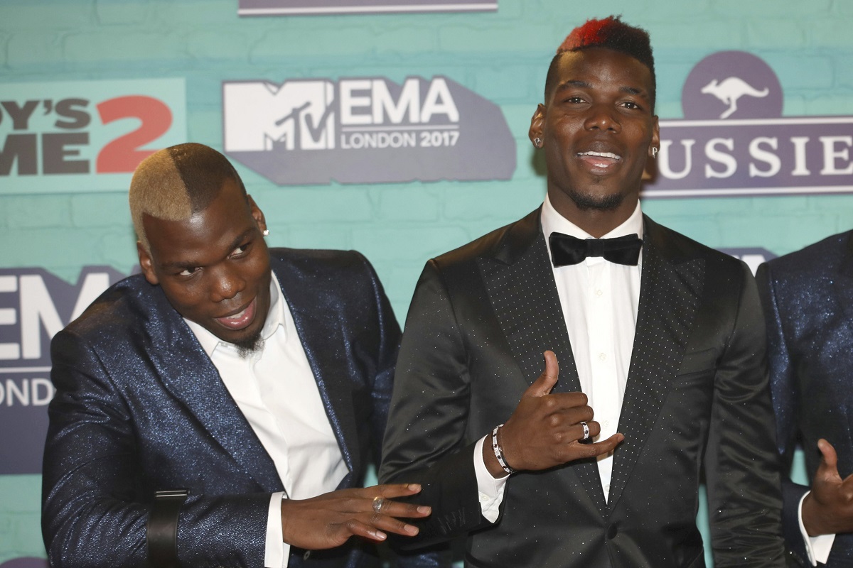 FILE - Soccer players Mathias Pogba, left, and Paul Pogba pose for photographers upon arrival at the MTV European Music Awards 2017 in London, Sunday, Nov. 12, 2017. (Vianney Le Caer/Invision/AP, File)