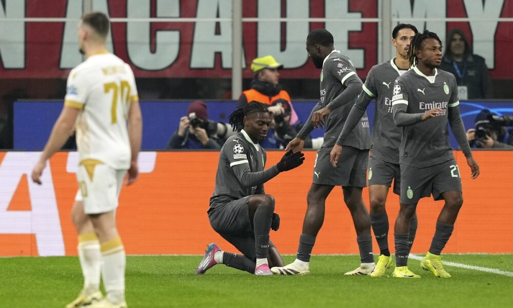 AC Milan's Rafael Leao celebrates with teammates after scoring his sides first goal during the Champions League opening phase soccer match between AC Milan and Red Star Belgrade, Crvena Zvezda, at the San Siro stadium in Milan, Italy, Wednesday, Dec. 11, 2024. (AP Photo/Antonio Calanni)