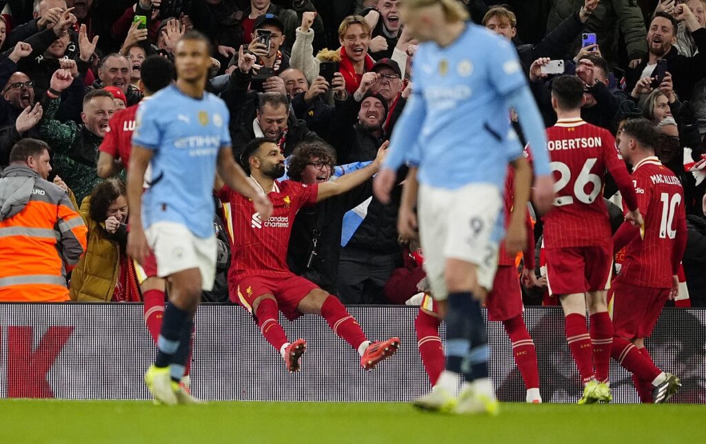 Liverpool's Mohamed Salah celebrates scoring during an English Premier League soccer match against Manchester City at Anfield Stadium, Liverpool, England, Sunday Dec. 1, 2024. (Peter Byrne/PA via AP)