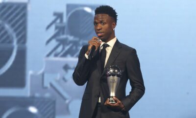 Vinicius Junior of Real Madrid talks after being awarded as the Best Men's FIFA Player during the FIFA Football Awards 2024 in Doha, Qatar, Tuesday, Dec. 17, 2024. (AP Photo/Hussein Sayed)